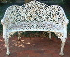 Antique cast iron garden bench in the rare Passion Flower design.